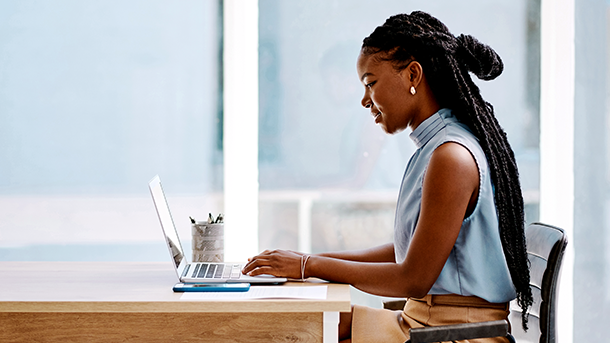 Female working in an office at a laptop